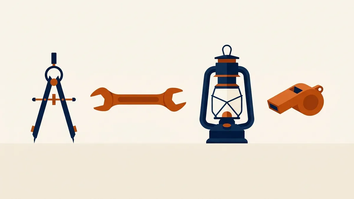 A compass, a wrench, a lantern and a whistle laid out on a desk